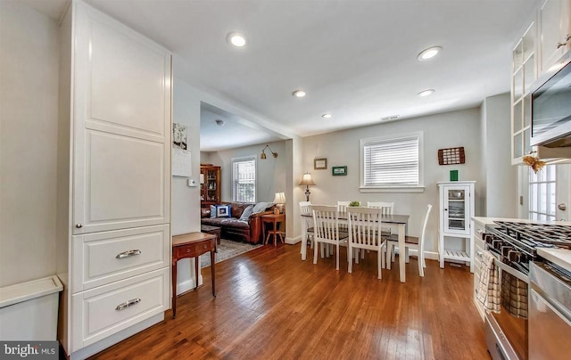 dining space featuring hardwood / wood-style flooring and plenty of natural light