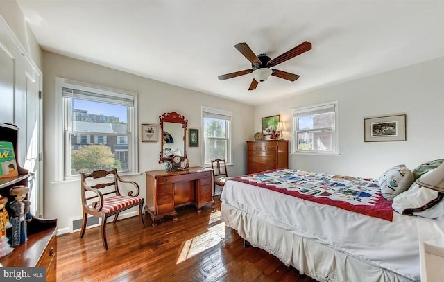 bedroom with dark wood-type flooring and ceiling fan