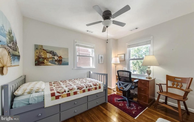 bedroom featuring ceiling fan and dark hardwood / wood-style floors