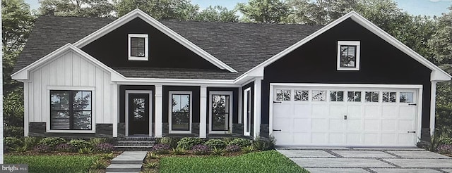 view of front facade with a garage, board and batten siding, driveway, and a shingled roof