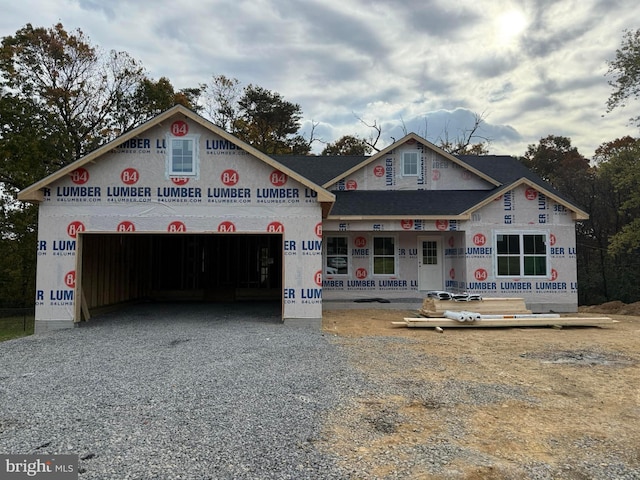 property in mid-construction featuring an attached garage and driveway