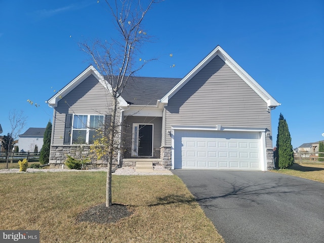 view of front facade featuring a front lawn and a garage