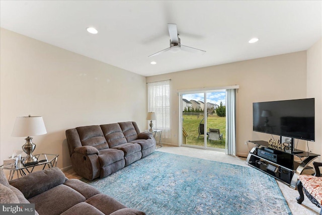 living room with carpet flooring and ceiling fan