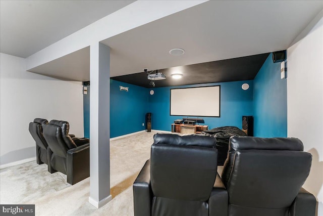 home theater room with light colored carpet