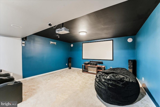 home theater room featuring carpet flooring