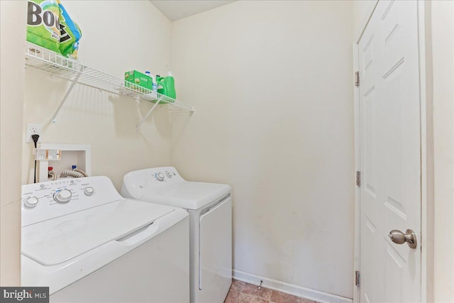 laundry room with independent washer and dryer