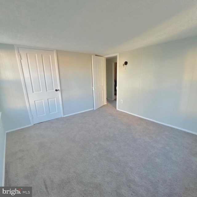 40 W Ridge St, Summit Hill, PA 18250 - unfurnished bedroom with baseboards, carpet flooring, and a closet