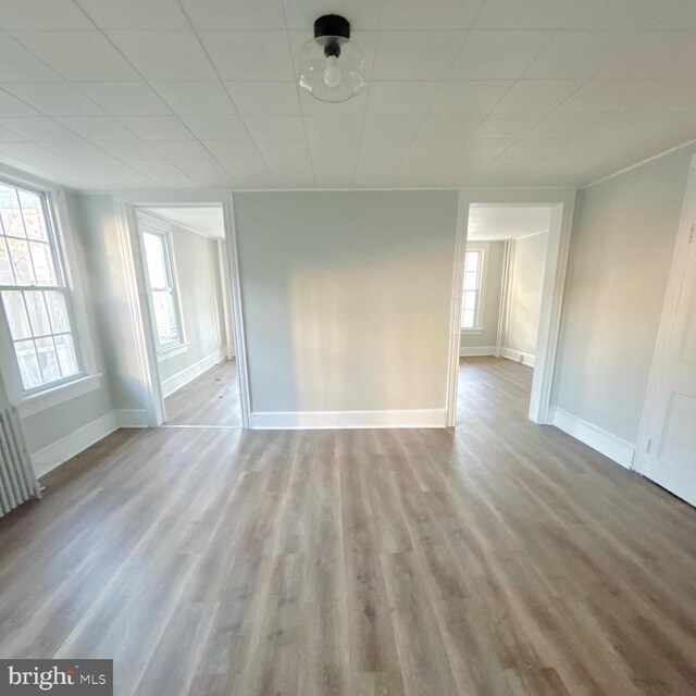 40 W Ridge St, Summit Hill, PA 18250 - spare room featuring a paneled ceiling, radiator, baseboards, and wood finished floors