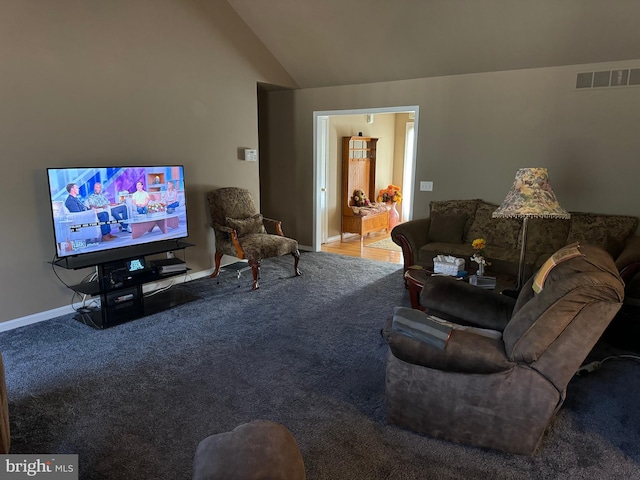 living room with lofted ceiling and carpet floors