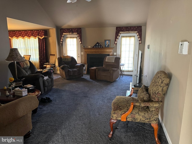 living room featuring carpet, vaulted ceiling, and ceiling fan