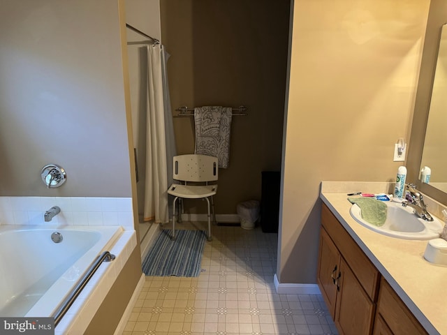 bathroom featuring vanity and a bath