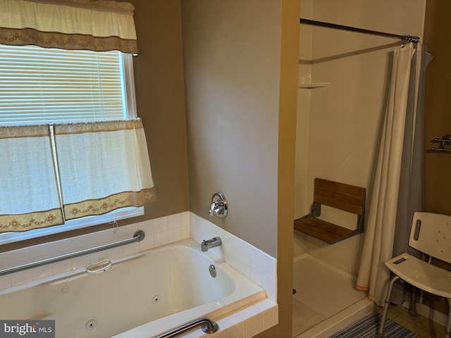 bathroom with shower with separate bathtub