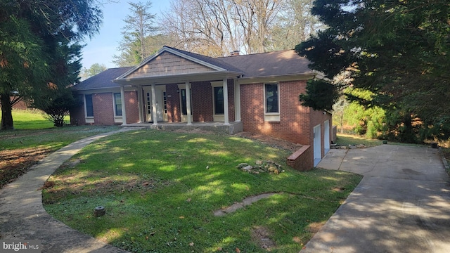 view of front of home with a front lawn and a garage