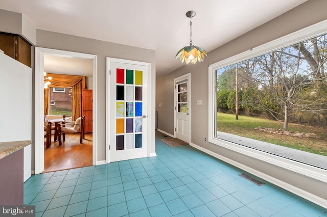 interior space with light tile patterned floors