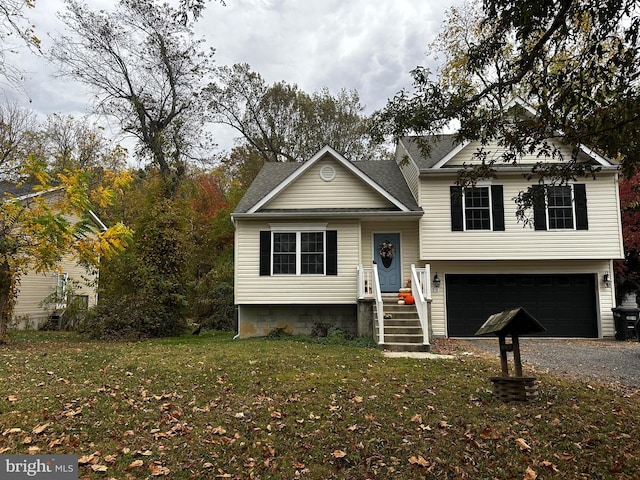 view of front of home featuring a garage and a front lawn