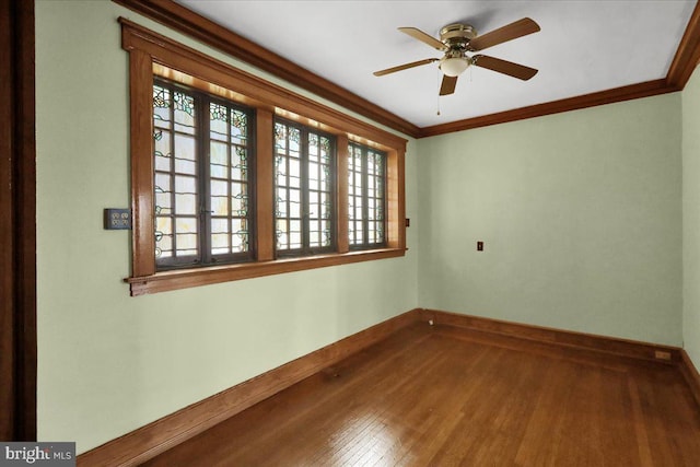 spare room featuring crown molding, wood-type flooring, and ceiling fan