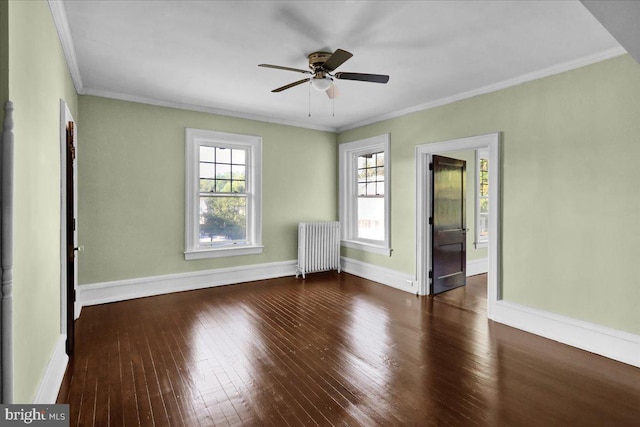 unfurnished room with crown molding, ceiling fan, dark hardwood / wood-style floors, and radiator