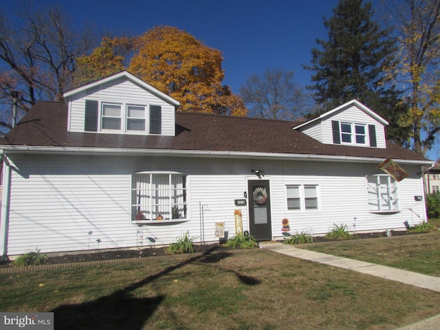 view of front of property with a front lawn