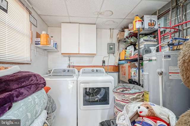 clothes washing area with cabinets, separate washer and dryer, and water heater