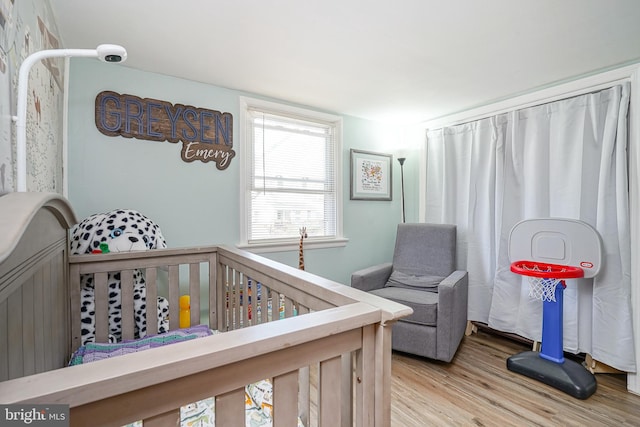 bedroom with hardwood / wood-style floors