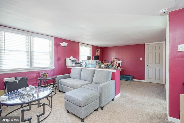 living room with light colored carpet and a healthy amount of sunlight