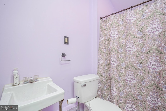 bathroom featuring sink and toilet