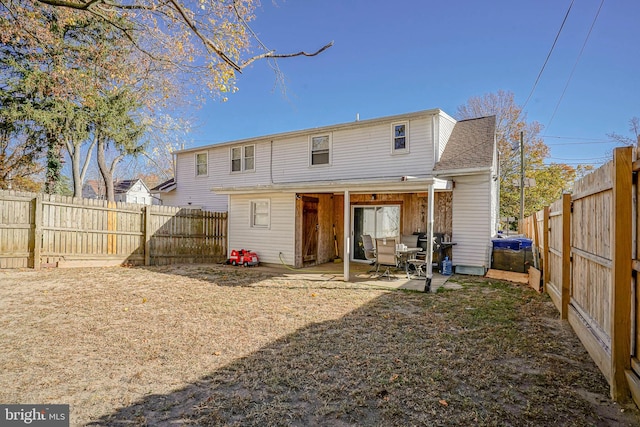 back of property featuring a patio