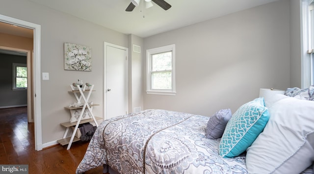 bedroom featuring dark hardwood / wood-style floors and ceiling fan