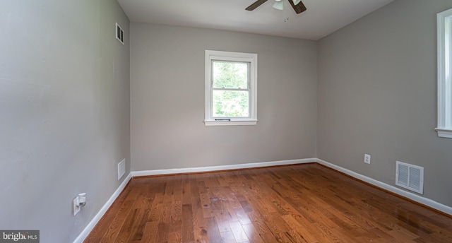 unfurnished room featuring hardwood / wood-style floors and ceiling fan