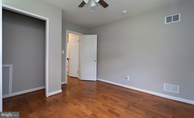 unfurnished bedroom featuring hardwood / wood-style floors and ceiling fan