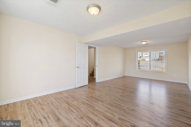 spare room featuring light hardwood / wood-style flooring