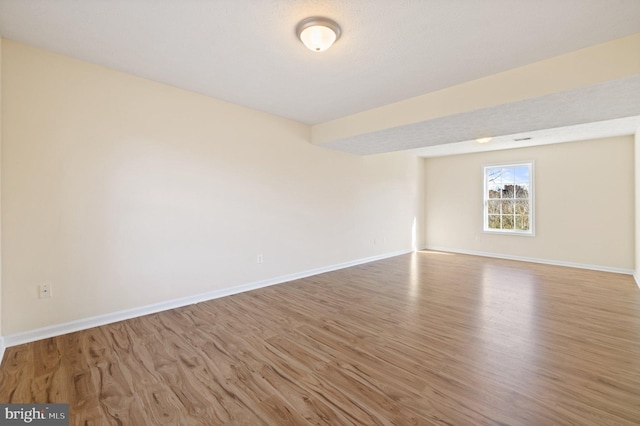 unfurnished room featuring hardwood / wood-style flooring