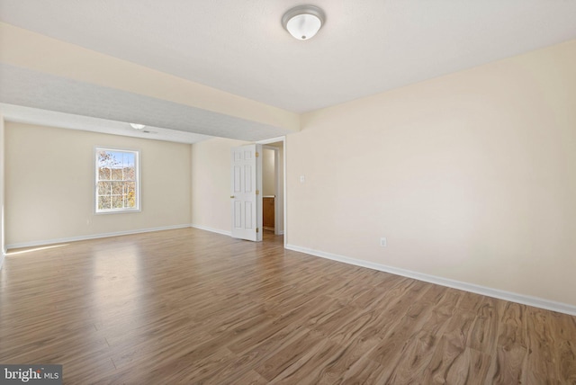 unfurnished room featuring hardwood / wood-style floors