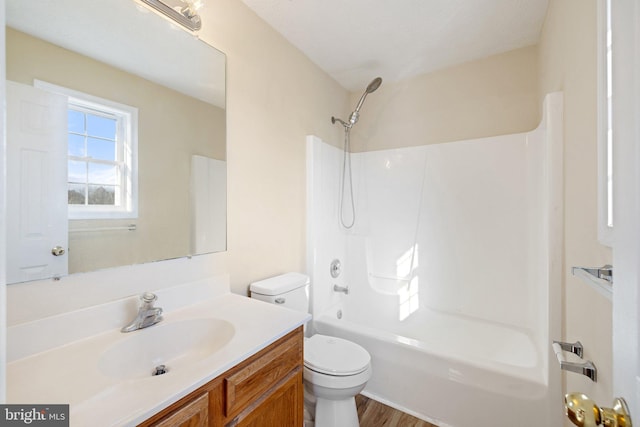 full bathroom with wood-type flooring, vanity, toilet, and shower / bathtub combination