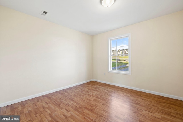 spare room with light hardwood / wood-style floors