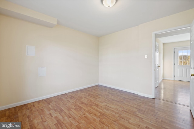 unfurnished room featuring light hardwood / wood-style flooring