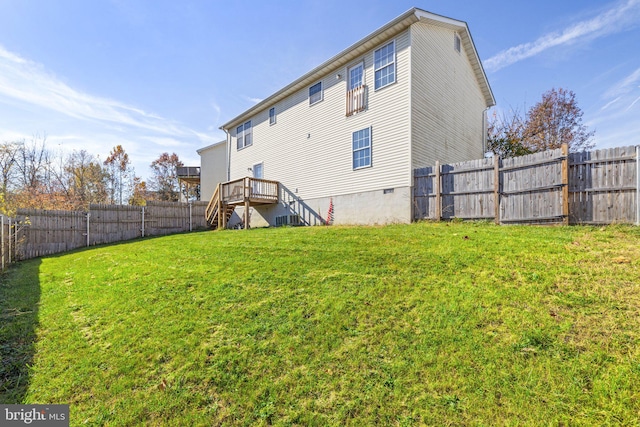 back of house with a lawn