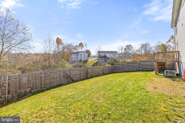 view of yard with a wooden deck