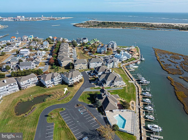 birds eye view of property with a water view