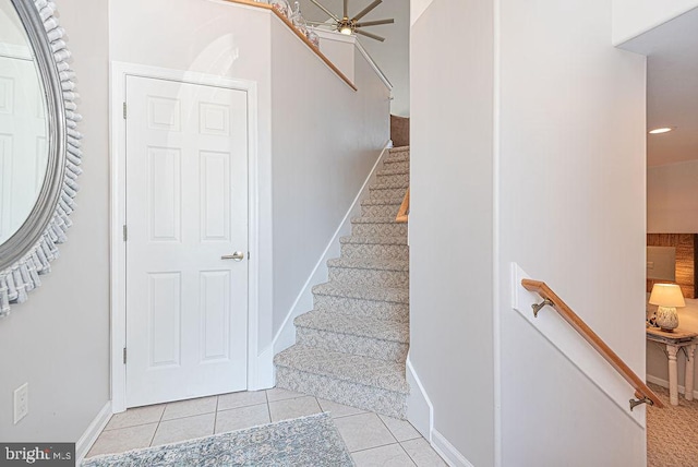 staircase with tile patterned flooring and ceiling fan