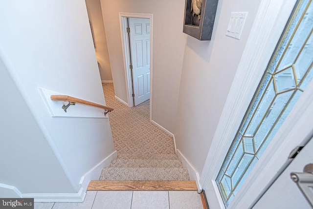 staircase with tile patterned flooring