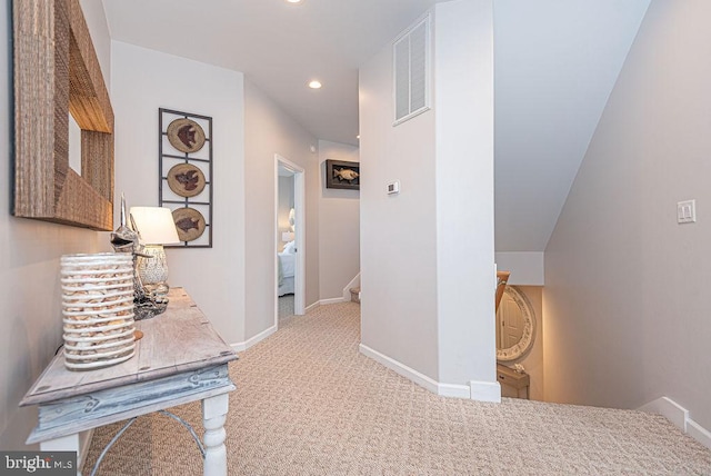 hallway with light carpet