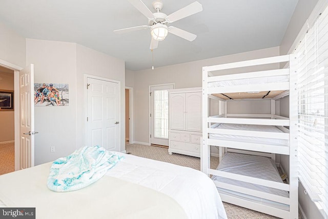 bedroom featuring ceiling fan and light carpet