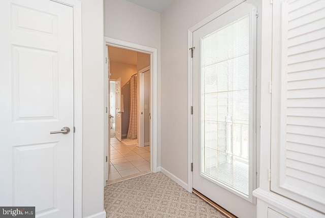 entryway featuring a healthy amount of sunlight and light tile patterned floors