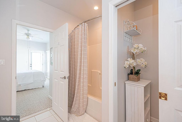 bathroom with shower / bath combo, tile patterned flooring, and ceiling fan