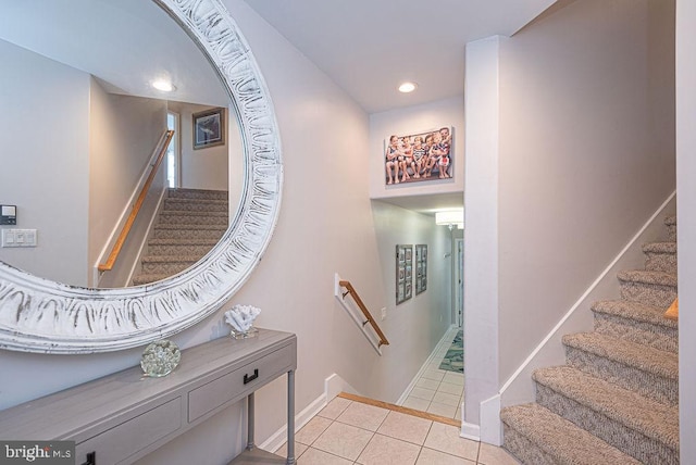 staircase featuring tile patterned flooring