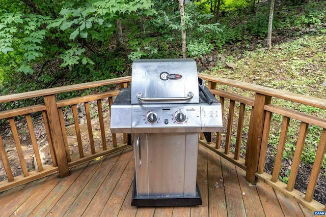 wooden deck featuring area for grilling