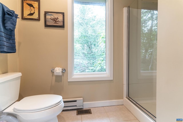 bathroom featuring tile patterned floors, a baseboard heating unit, toilet, and walk in shower