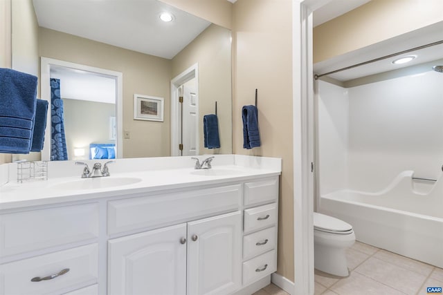 full bathroom with vanity, bathing tub / shower combination, toilet, and tile patterned flooring