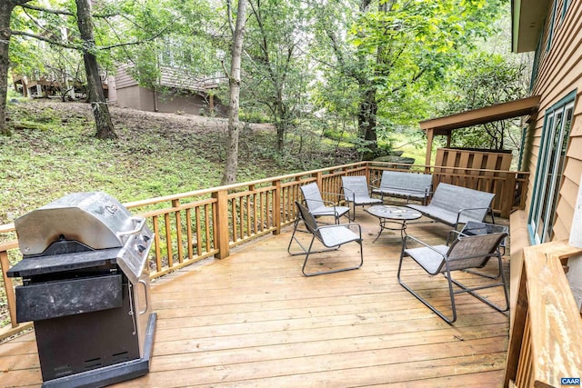 wooden terrace with grilling area and outdoor lounge area